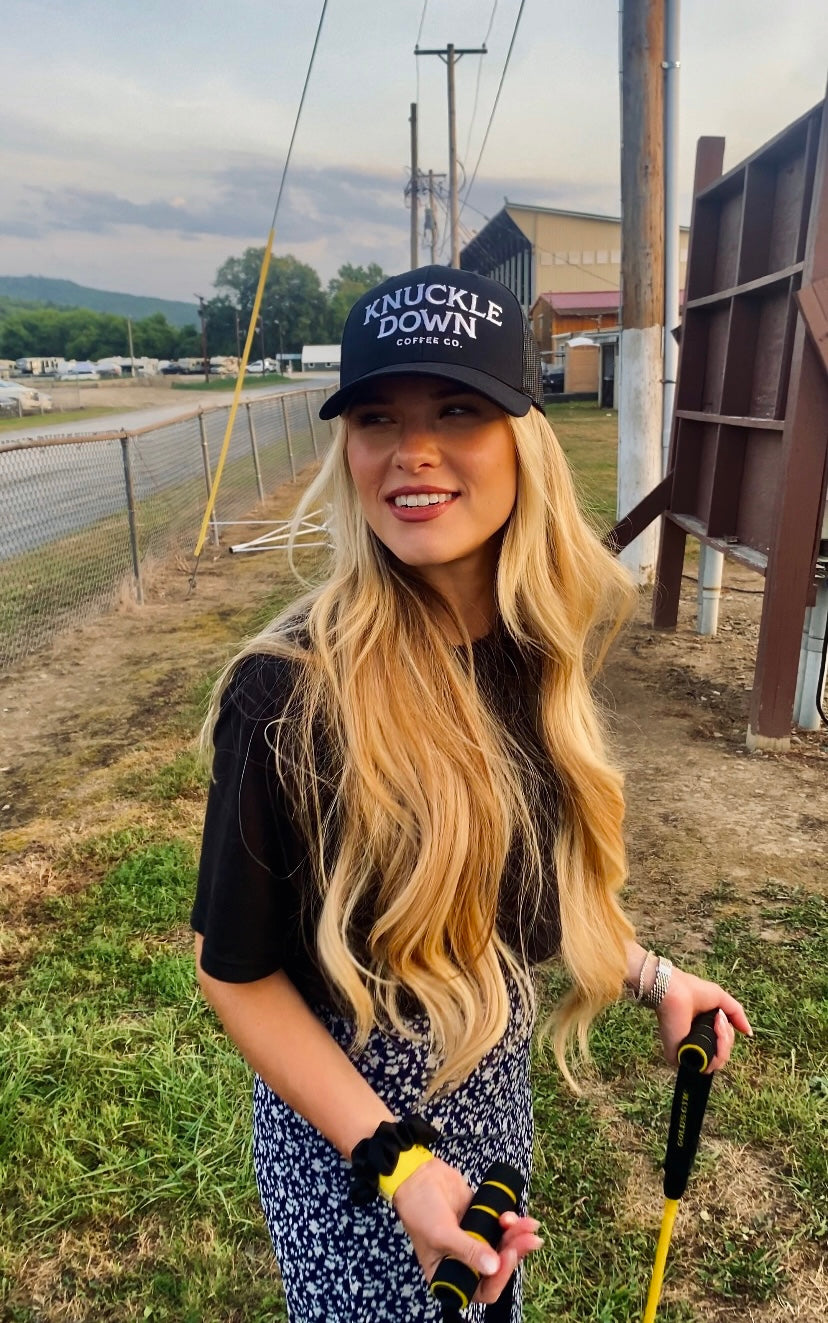 Knuckle Down Coffee trucker hat worn outdoors in Norwich
